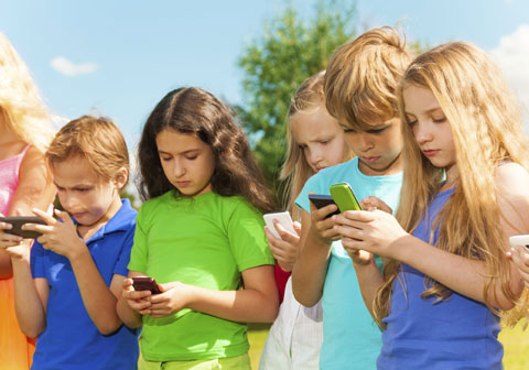 group of children on mobile devices