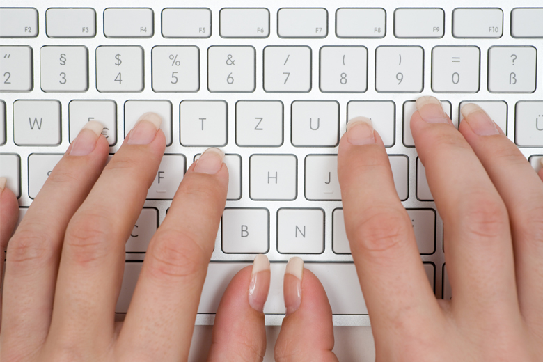 women's hands over keyboard