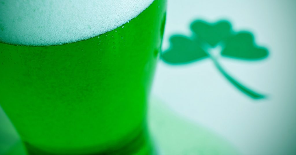 Close up of green beer and shamrock