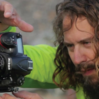 Man taking video with Nikon camer